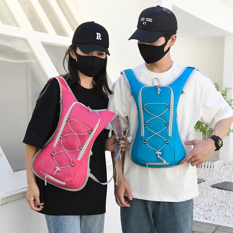 Models wearing blue and pink 10-15L cycling backpacks